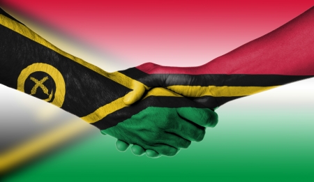 Man and woman shaking hands, wrapped in flag pattern, Vanuatuの写真素材