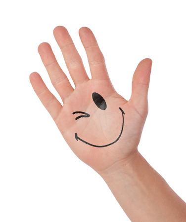 Hand with smiley isolated on white, concept of communication, blinkingの写真素材