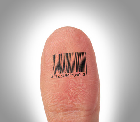Macro view of a thumb finger over a white background, barcodeの写真素材