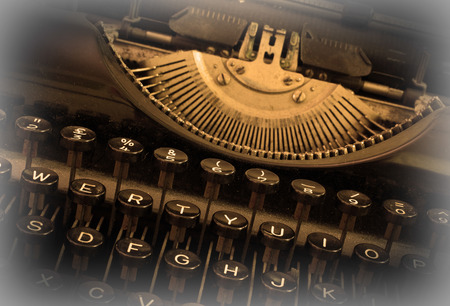 Close up of a dirty vintage typewriter, warm filterの写真素材
