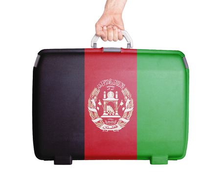 Used plastic suitcase with stains and scratches, printed with flag, Afghanistanの写真素材