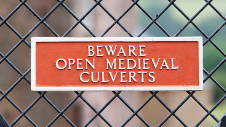 Red sign - Beware of open medieval culverts