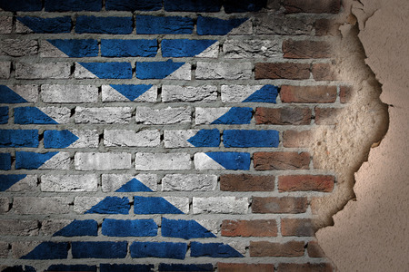 Dark brick wall texture with plaster - flag painted on wall - Scotlandの写真素材