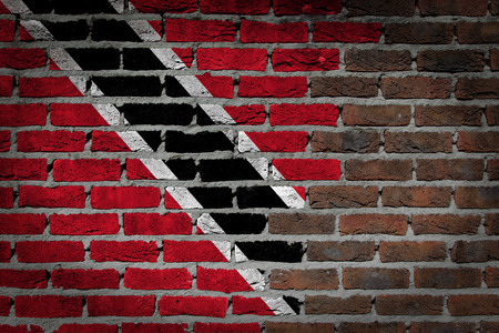 Very old dark red brick wall texture with flag - Trinidad and Tobagoの写真素材
