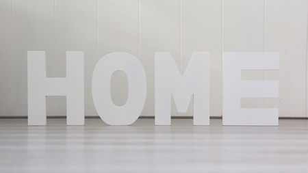Four letters on the wooden floor - Homeの写真素材