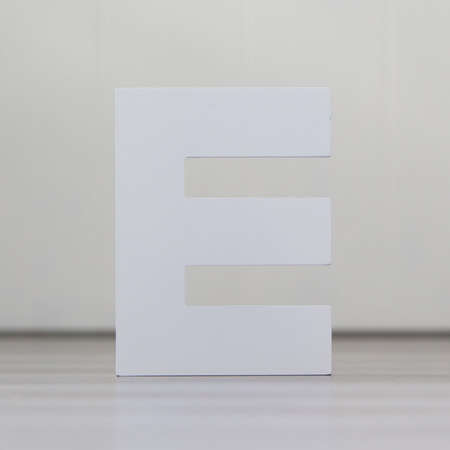 One letter on the wooden floor - Eの写真素材