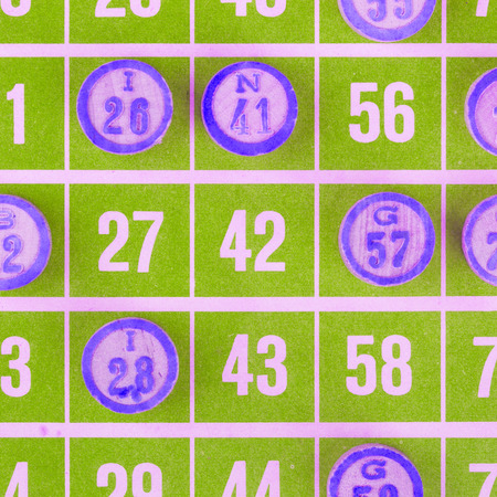 Green bingo card being used (white chips)の写真素材