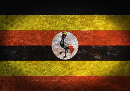 Old rusty metal sign with a flag - Ugandaの写真素材