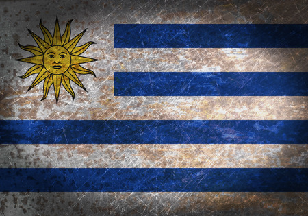 Old rusty metal sign with a flag - Uruguayの写真素材