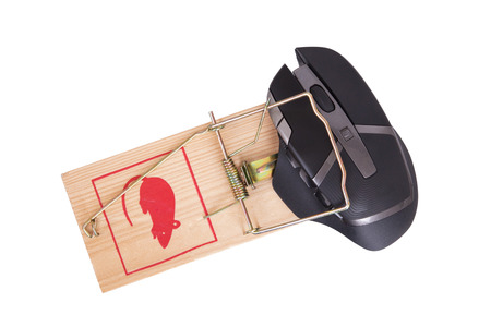 Modern computer mouse in a mousetrap against white backgroundの写真素材