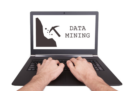 Man working on laptop, data mining, isolatedの写真素材