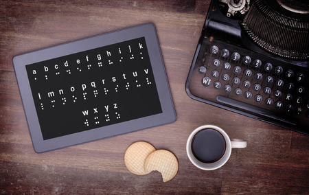 Braille on a tablet, concept of impossibility, vintage lookの写真素材