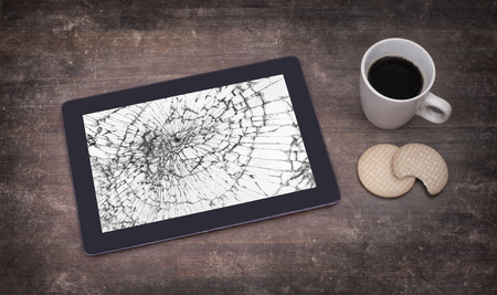 Tablet computer with broken glassの写真素材