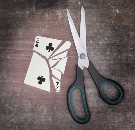 Concept of addiction, card with scissorsの写真素材