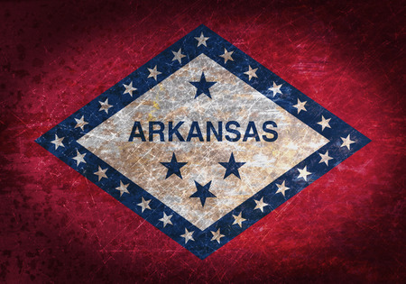 Old rusty metal sign with a flag - Arkansasの写真素材