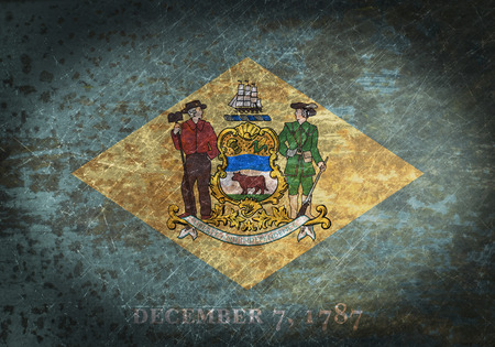 Old rusty metal sign with a flag - Delawareの写真素材