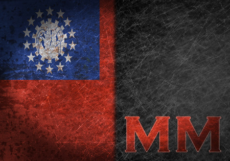 Old rusty metal sign with a flag and country abbreviation - Myanmarの写真素材