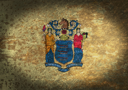 Old rusty metal sign with a flag - New Jerseyの写真素材