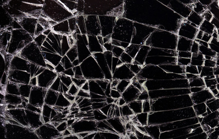 Full screen broken glass, black background horizontal