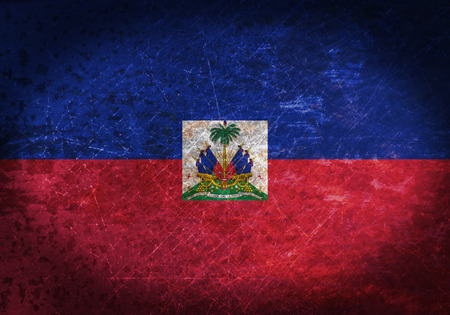 Old rusty metal sign with a flag - Haitiの写真素材