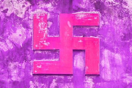 NHA TRANG, VIETNAM 31 JULY 2012 - Swastika symbol on an ancient temple in Nha Trang. The swastika symbol stands for affirmation of good luck. Nha Trang, 31 JULY 2012 Vietnamの写真素材