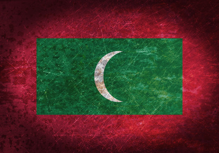 Old rusty metal sign with a flag - Maldivesの写真素材