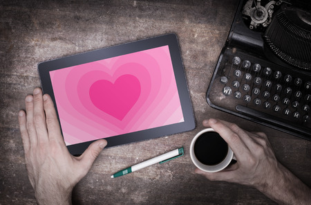 Heart shape backgound on a tablet - Concept of love - pinkの写真素材