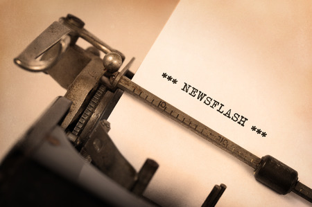 Close-up of a vintage typewriter, old and rusty, newsflashの写真素材