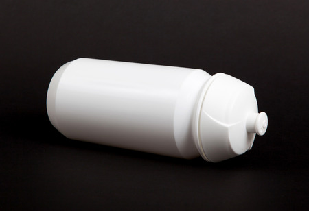 White water bottle isolated on black background