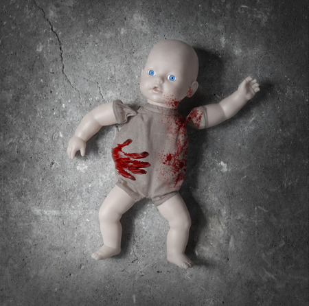Concept of child abuse - Bloody doll, vintageの写真素材