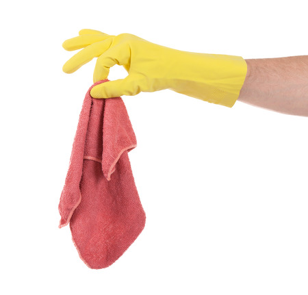 Hand in rubber glove holding a napkin - isolatedの写真素材