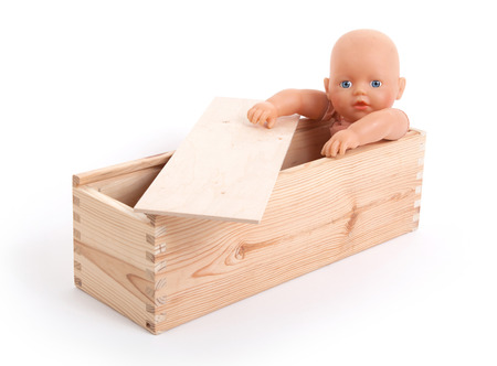 Baby toy in wooden box, isolated on whiteの写真素材