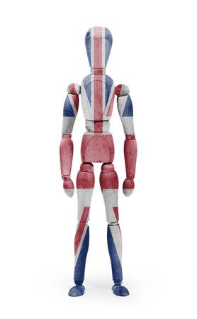 Wood figure mannequin with United Kingdom flag bodypaint on white backgroundの写真素材