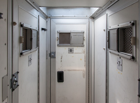 Inside of a large bus used by police to transport prisoners for public safety