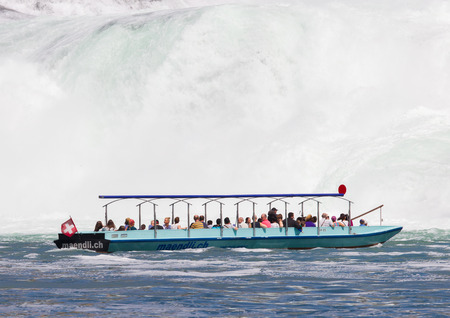 RHEINFALLS, SWITZERLAND - JULY 25, 2015: View to the biggest waterfalls of Europe in Schaffhausen, Switzerland on May 17, 2015. They are 150 m (450 ft) wide and 23 m (75 ft) high.のeditorial素材