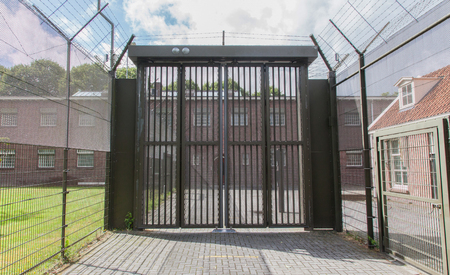 Large gate at an old dutch jailの写真素材