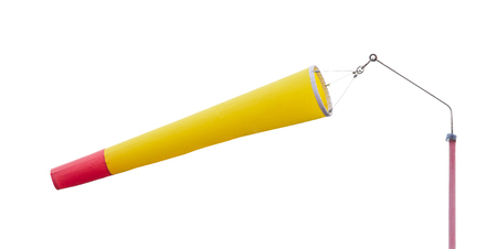 Yellow windsock indicating strong wind on grey sky