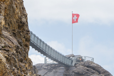 LES DIABLERETS, SWIZTERLAND - JULY 22: People walk at the Glacier 3000 on July 22, 2015. The area houses the world only suspension bridge between 2 mountain peaks.のeditorial素材