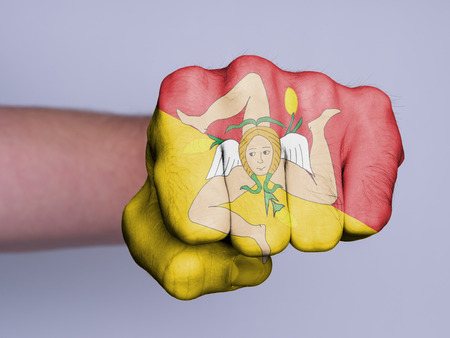 Very hairy knuckles from the fist of a man punchingの写真素材