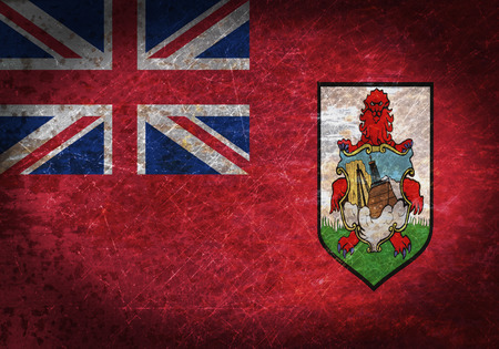 Old rusty metal sign with a flag - Bermudaの写真素材