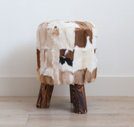 Small stool made of cowhide and woodの写真素材