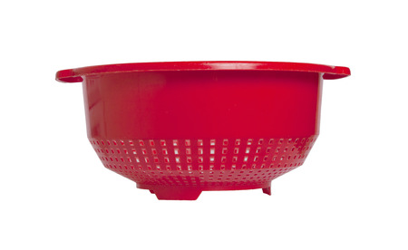 Red empty colander isolated over white backgroundの写真素材