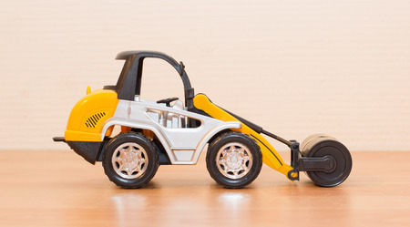 Roadword roller isolated, childrens toy, selective focus