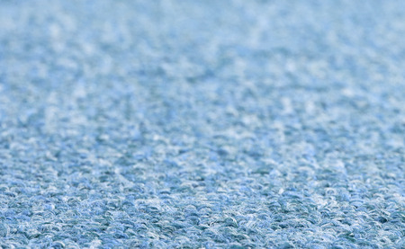 Carpet texture close-up, blue furry carpet texture background, selective focusの写真素材