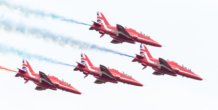 LEEUWARDEN, THE NETHERLANDS - JUNE 10, 2016: RAF Red Arrows performing at the Dutch Air Force Open House on June 10, 2016 at Leeuwarden Airfield, The Netherlands.のeditorial素材