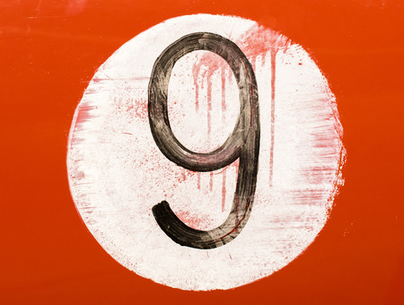 Painted number on an old car, isolatedの写真素材