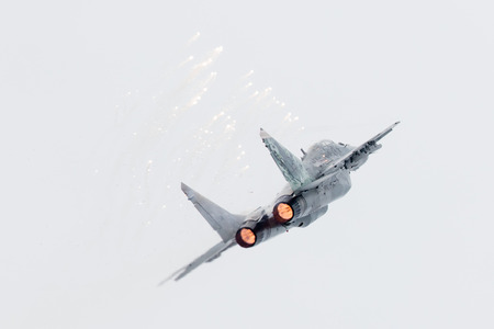 LEEUWARDEN, THE NETHERLANDS - JUNE 10, 2016: Slovak Air Force MiG-29 Fulcrum firing off flares during a demonstration at the Royal Netherlands Air Force Daysのeditorial素材