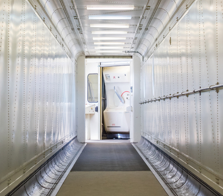 Jetway, walking towards the plane, seeing the door of the plane, selective focus