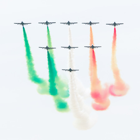 LEEUWARDEN, THE NETHERLANDS-JUNE 10, 2016: Italian aerobatic team Frecce Tricolori (Tricolor arrows) performs a show at the Dutch Airshow on June 10, 2016 at Leeuwarden Airfield, The Netherlands.のeditorial素材