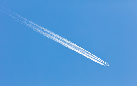 Large aircraft flying in sky, 4 stripes in the sky